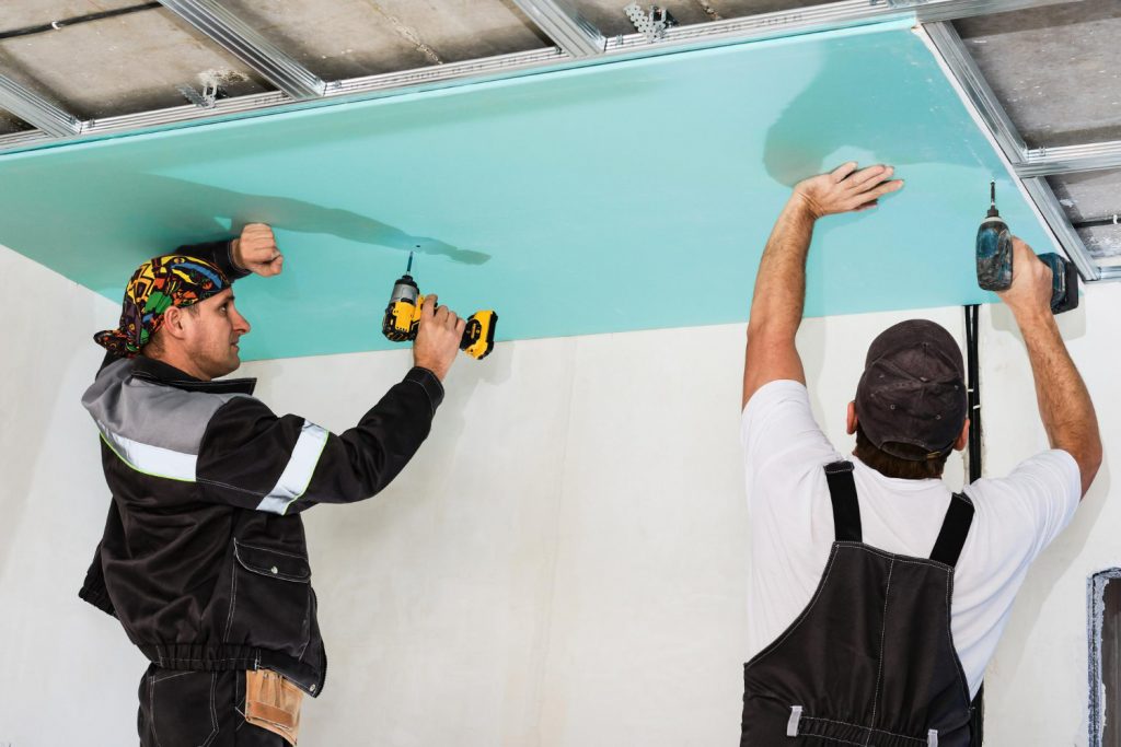 plasterboard-installers-men-assembling-drywall-false-ceiling-simple-affordable-renovation-premises